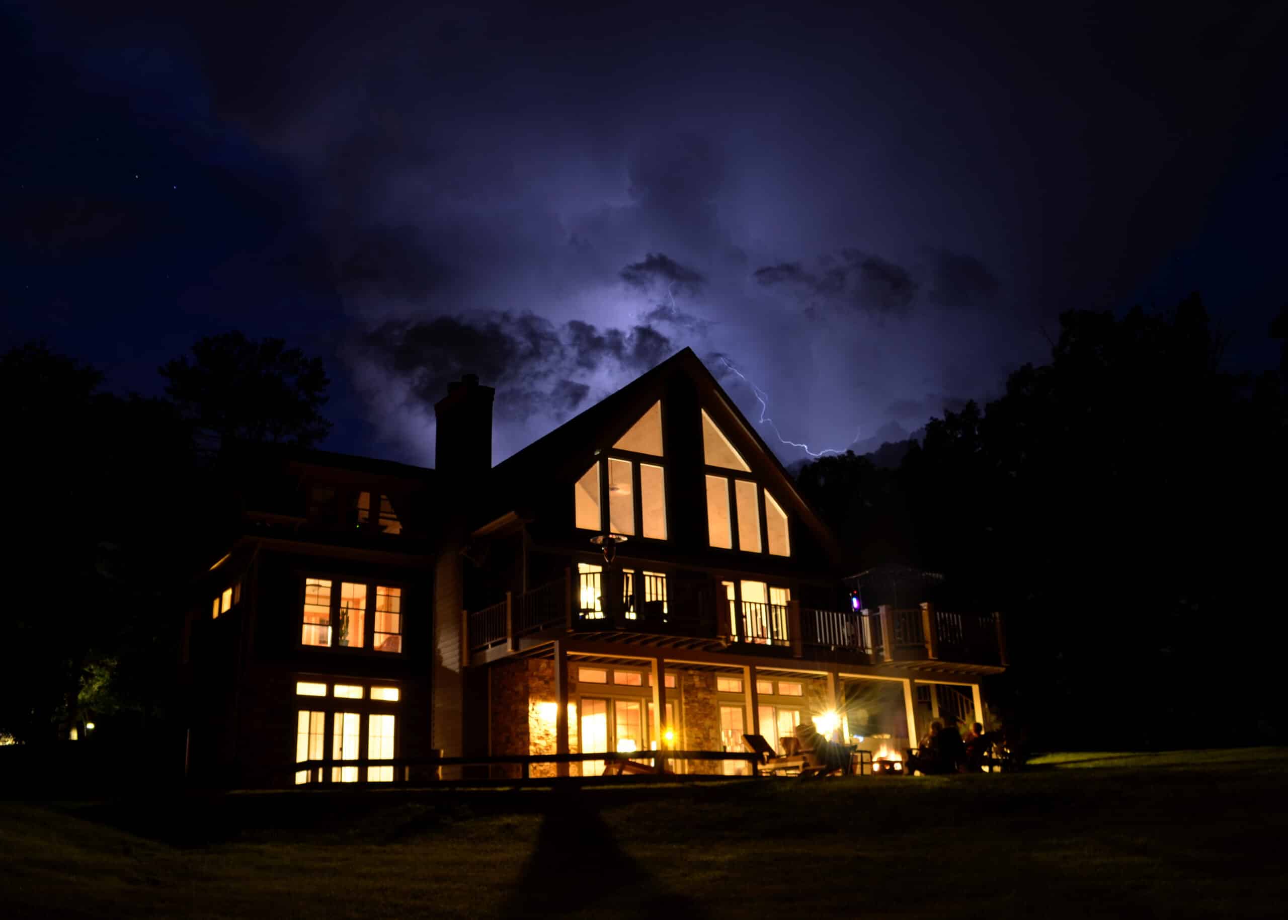 Lightning storm over a cabin