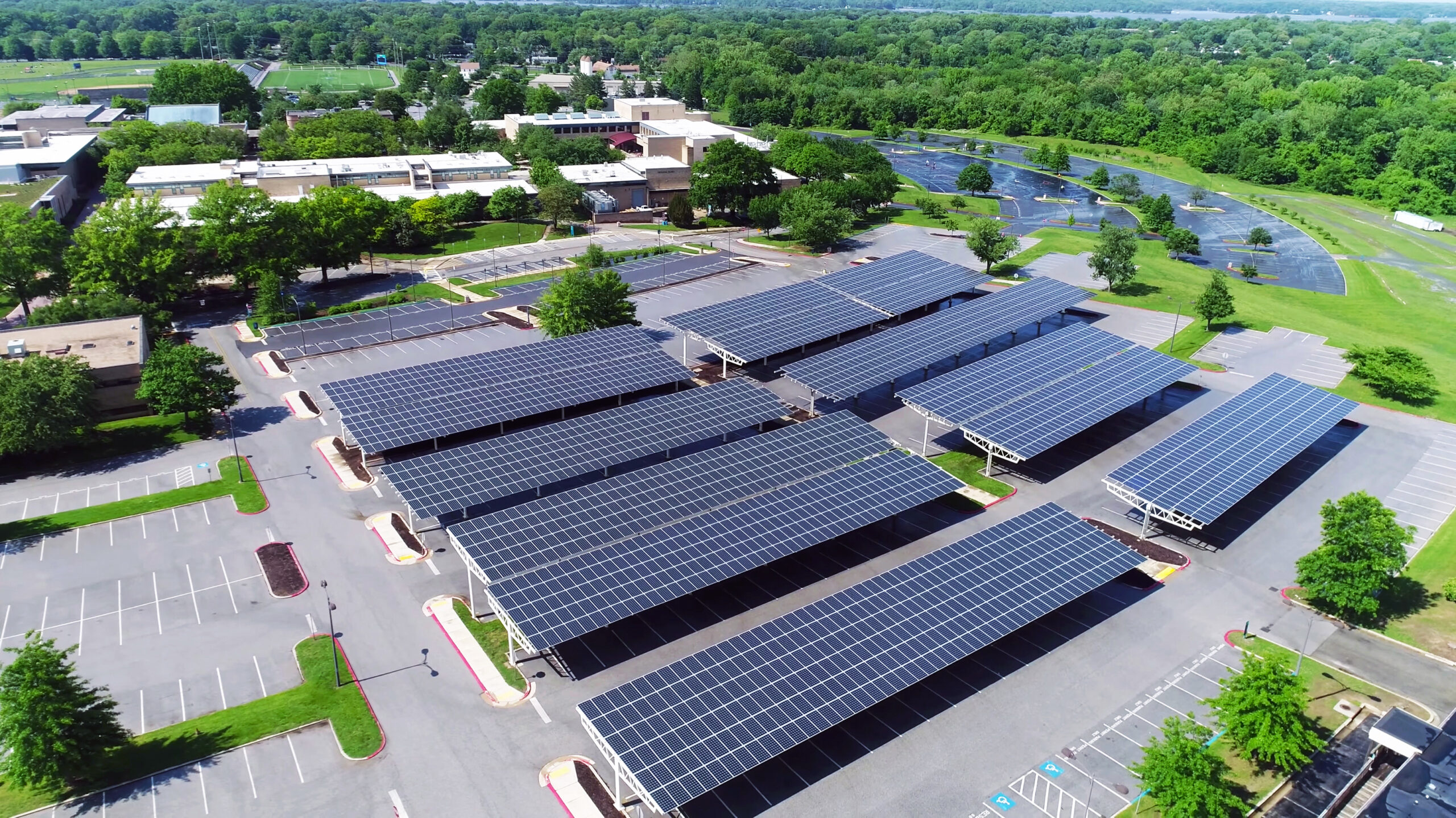 aerial view of solar panels installed in parking